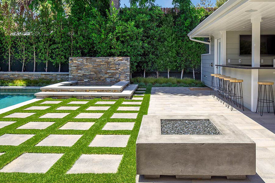 Creating a Low-Maintenance Backyard with Pavers and Turf